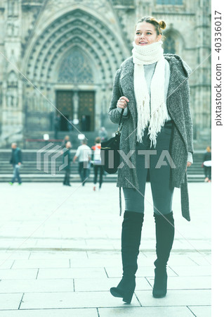 Cheerful young girl in scarf at the street Cheerful young girl in scarf at the street 40336017