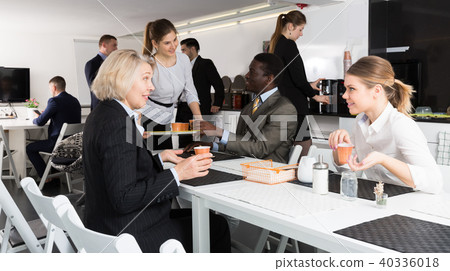 business partners drink coffee and communicate business partners drink coffee and communicate 40336018