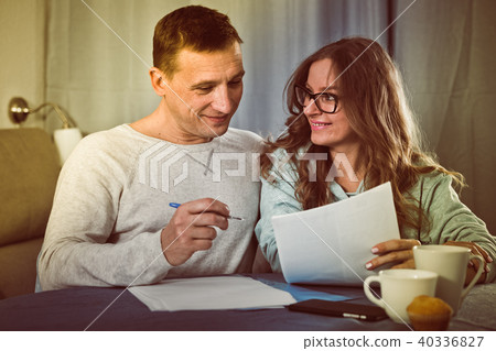 Couple signing papers Couple signing papers 40336827