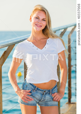 Female is posing on pirce in her free time 40337008