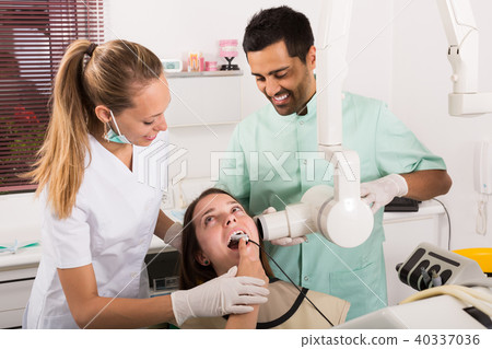 patient checking the teeth an digital xray patient checking the teeth an digital xray 40337036