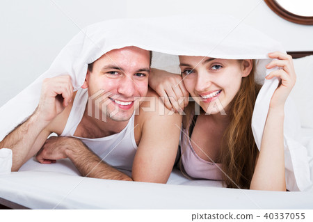 Loving couple hiding under cover 40337055