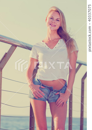 Female is posing on pirce in her free time Female is posing on pirce in her free time 40337075