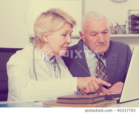 Female doctor with male client Female doctor with male client 40337785