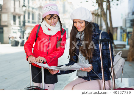 adult female and daughter with map adult female and daughter with map 40337789