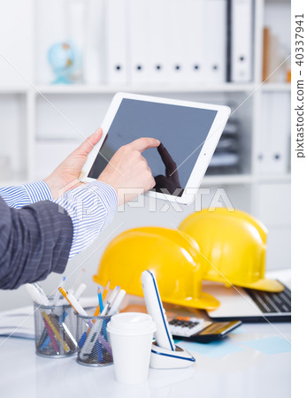 Hands of businesswoman using tablet Hands of businesswoman using tablet 40337941