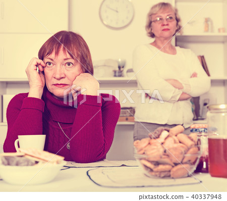 Upset mature woman after discord with female friend 40337948
