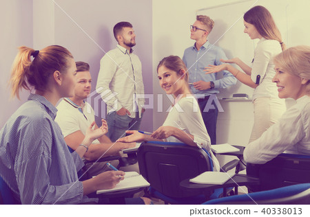 students talking with teacher and with each other