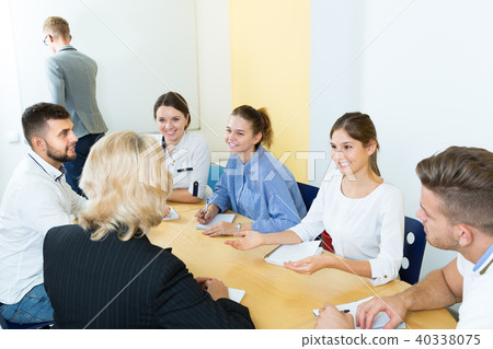 Students doing group brainstorming in auditorium 40338075