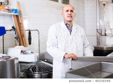 Portrait of mature man working in modern food factory 40338349