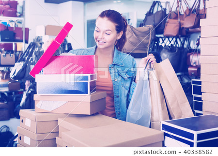 girl with carton packages in bags shop . girl with carton packages in bags shop . 40338582