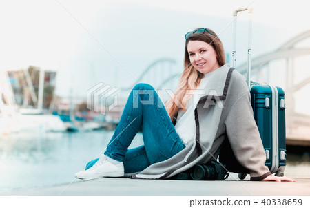 Female tourist standing at pier 40338659