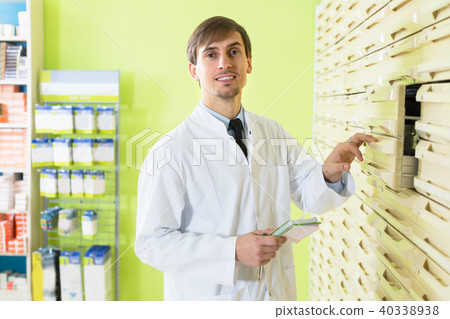pharmacist working in pharmacy pharmacist working in pharmacy 40338938