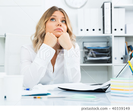 Pensive young girl in business clothes in modern office 40339149