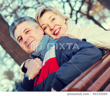 cheerful mature married couple holding hands each other in park cheerful mature married couple holding hands each other in park 40339364