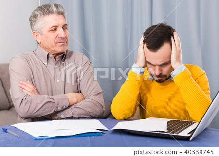 Adult father and son discuss contract Adult father and son discuss contract 40339745