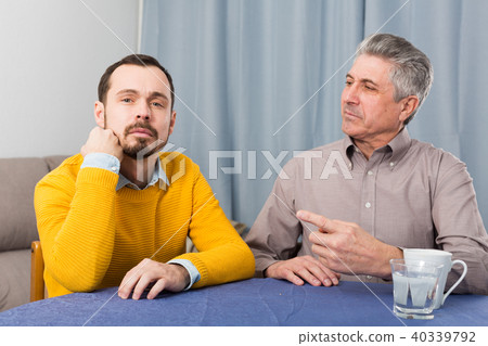 Mature father and son serious talk Mature father and son serious talk 40339792