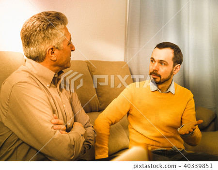 Adult father and son solve problems Adult father and son solve problems 40339851