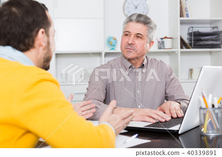 Men sign credit agreement Men sign credit agreement 40339891