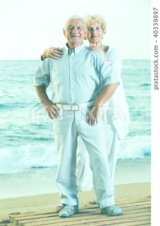 pensioners standing together on the sea coast 40339897