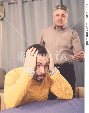 Adult father teaches his son 40339954