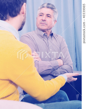 Adult father and son solve problems 40339985