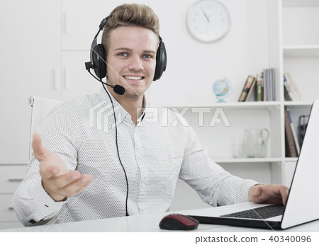 Portrait of young businessman with headset Portrait of young businessman with headset 40340096