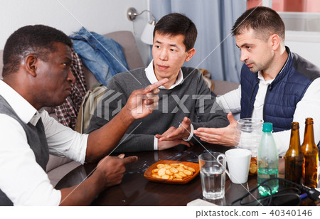 Three serious friends are talking about life together Three serious friends are talking about life together 40340146