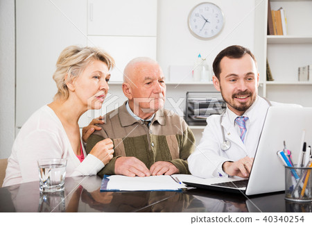 Old father with daughter visit doctor Old father with daughter visit doctor 40340254