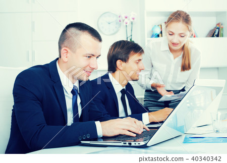 Coworkers working on document paper 40340342