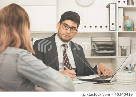Businessman talking to colleague Businessman talking to colleague 40340419