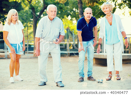 Happy family playing petanque in outdoor Happy family playing petanque in outdoor 40340477