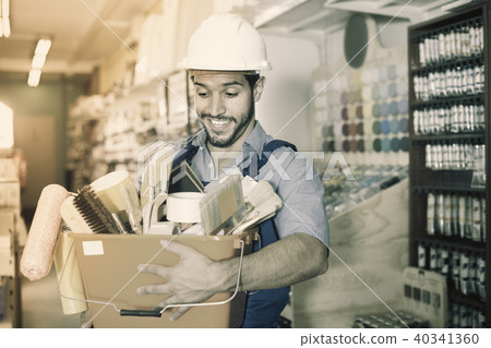 Man master in helmet holding basket with tools Man master in helmet holding basket with tools 40341360
