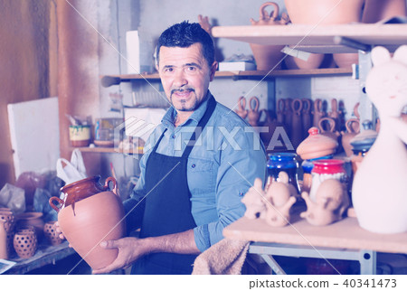 artisan having ceramics in hands 40341473