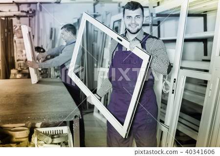 positive male professional labours with finished PVC profiles and windows positive male professional labours with finished PVC profiles and windows 40341606