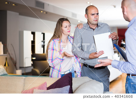 Friendly family couple dissatisfied with service Friendly family couple dissatisfied with service 40341608