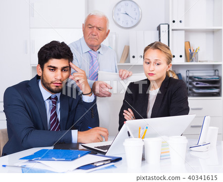 Old man is having complicated issue with reports made by subordinates 40341615