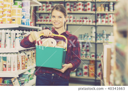 female is standing with instruments for repair 40341663