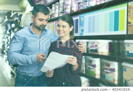designer with shop list looking color of paint designer with shop list looking color of paint 40341934
