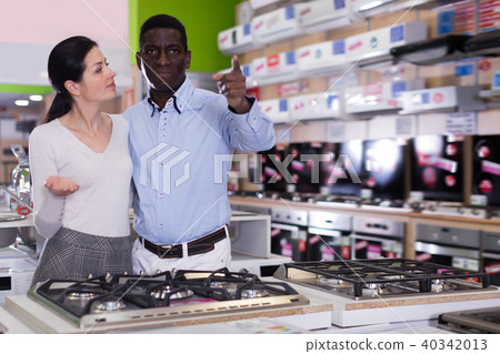 Nice couple chooses cooktop in store Nice couple chooses cooktop in store 40342013