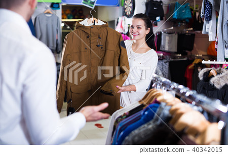 Couple choosing new coat Couple choosing new coat 40342015