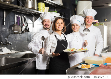 Smiling female waiter taking ordered dishes 40342592