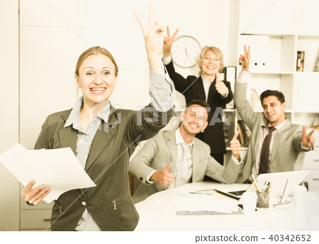 Happy business group with woman at office Happy business group with woman at office 40342652