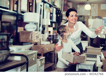 Woman and daughter choosing new curbstone Woman and daughter choosing new curbstone 40342766