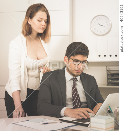 Businessman and businesswoman working together 40343191
