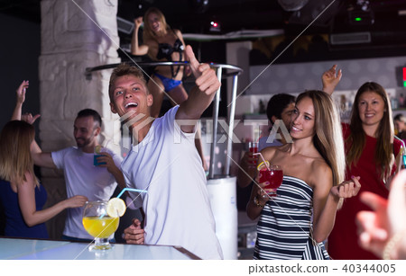 smiling male joying and thumbs up on party 40344005