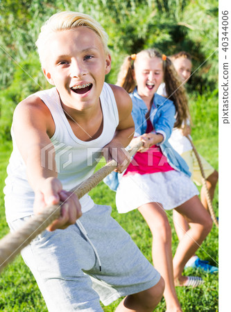 Children playing tug of war outdoors Children playing tug of war outdoors 40344006