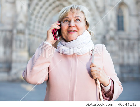 woman talking on mobile phone woman talking on mobile phone 40344182
