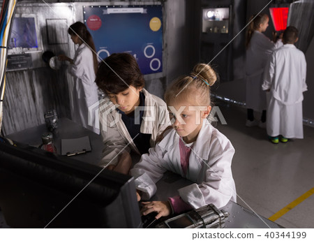 schoolchild solve riddles in the quest room bunker 40344199