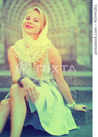 Positive female in the shawl at the street Positive female in the shawl at the street 40344261